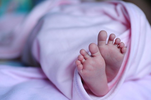 baby wrapped in blanket