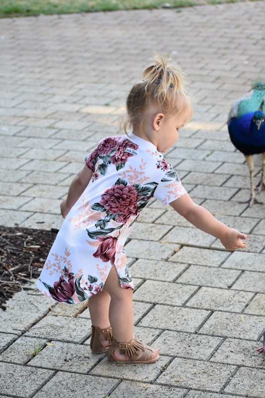 little girl on a flower printed dress